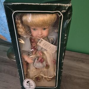 Vintage Geppedo Porcelain Doll with Blonde Hair and Blue Dress